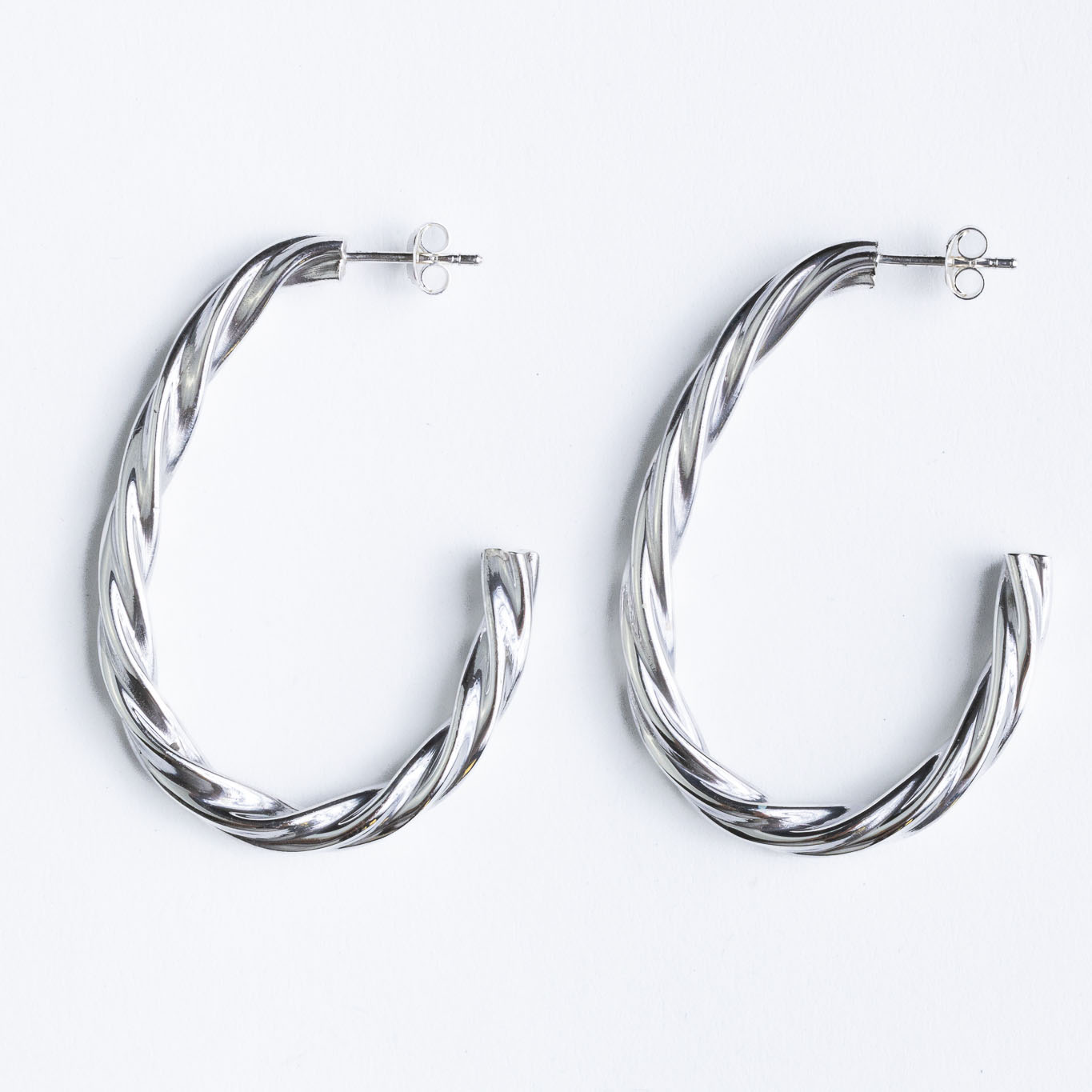 Srebrne naušnice “Pletene polualke” Srebrne naušnice “Pletene polualke”